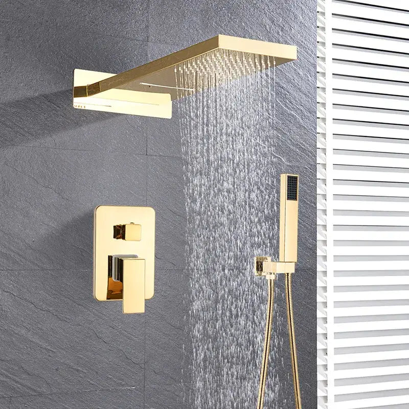 Gold-toned rectangular rain shower head with matching wall-mounted control valve and handheld shower faucet set