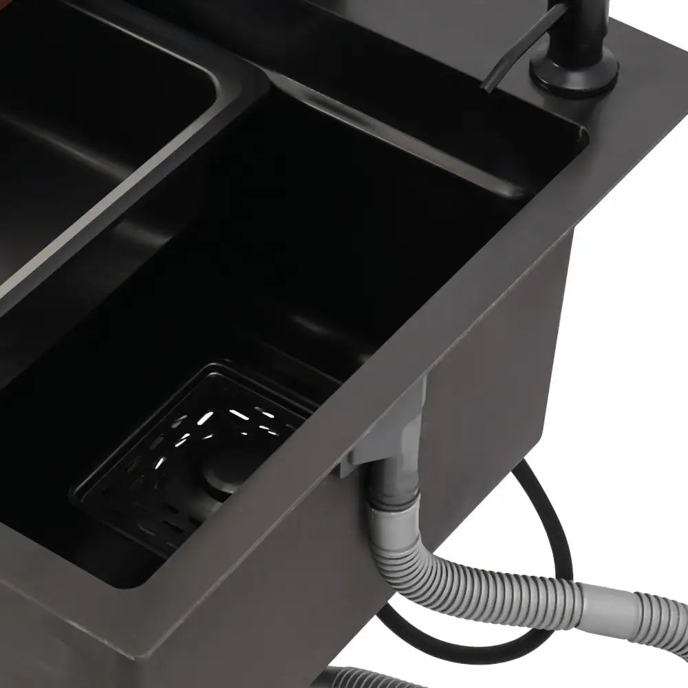 Modern matte black utility sink with integrated kitchen accessories - Decorbites