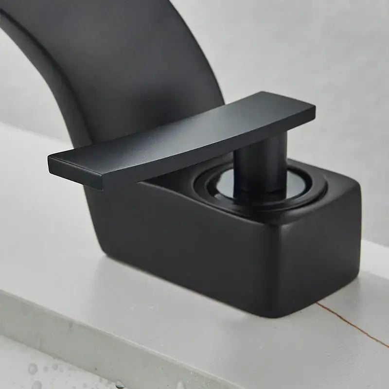 Modern matte black waterfall basin faucet with rectangular handle and square base for black waterfall bathroom decorbites