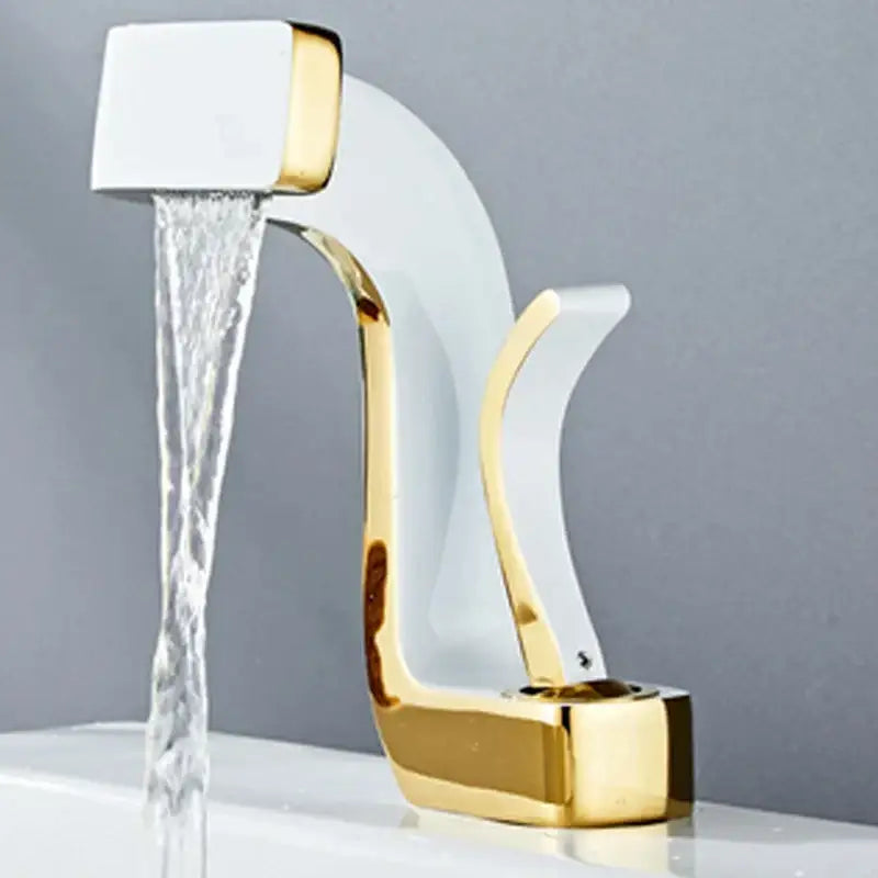 A sleek modern basin faucet with white ceramic body and gold accents designed as a decorbites black waterfall bathroom mixer