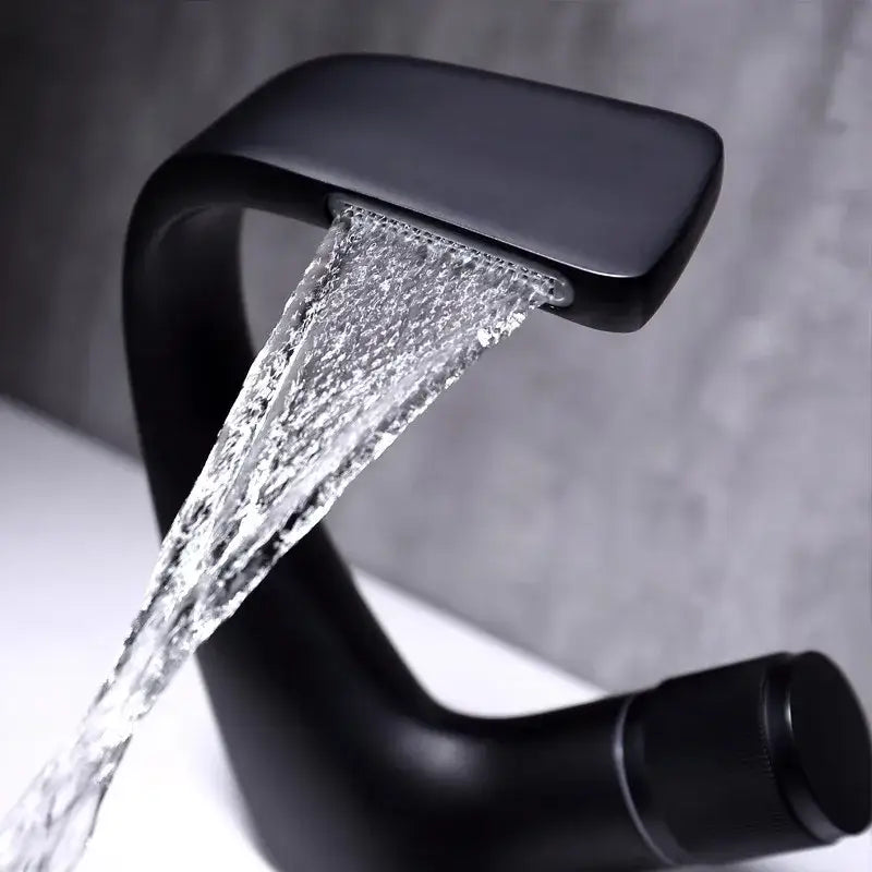 Modern matte black basin faucet with sleek curved design and waterfall water flow for decorbites gray basin bathroom sink
