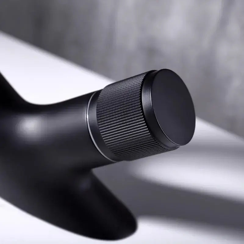 Modern matte black waterfall basin faucet with black matte finish and ribbed grip for decorbites gray basin use