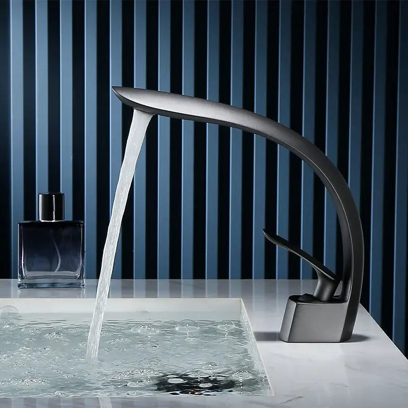 Modern matte black basin faucet single handle mixer with sleek curved design and waterfall spout for bathroom use