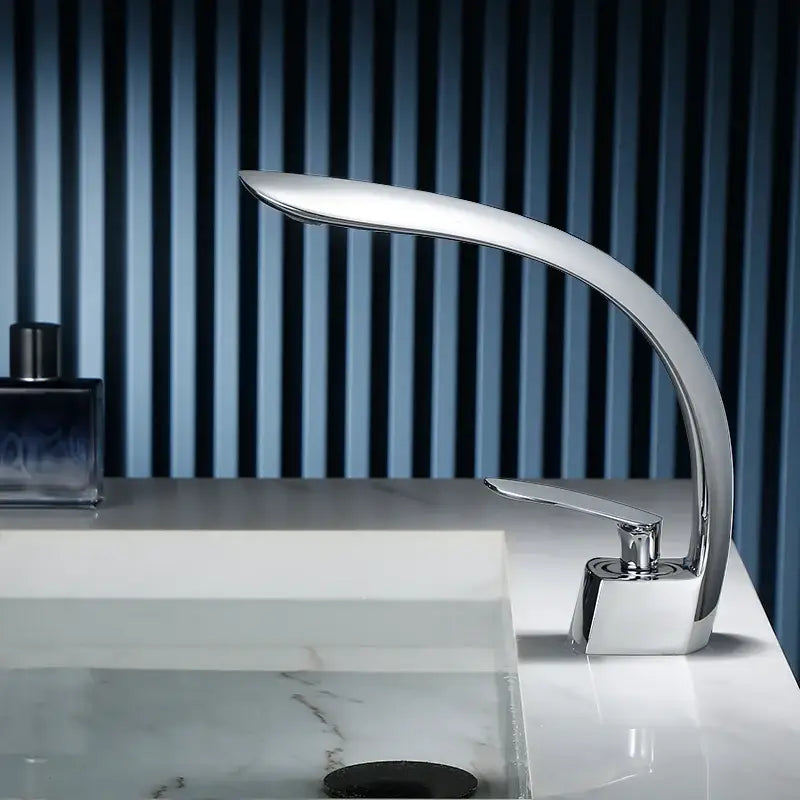 Modern chrome finished waterfall basin faucet single handle mixer with sleek curved design for bathroom use