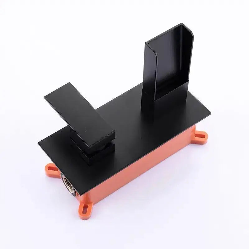 Modern matte black waterfall basin mixer tap with black and orange plastic mounting bracket for secure installation