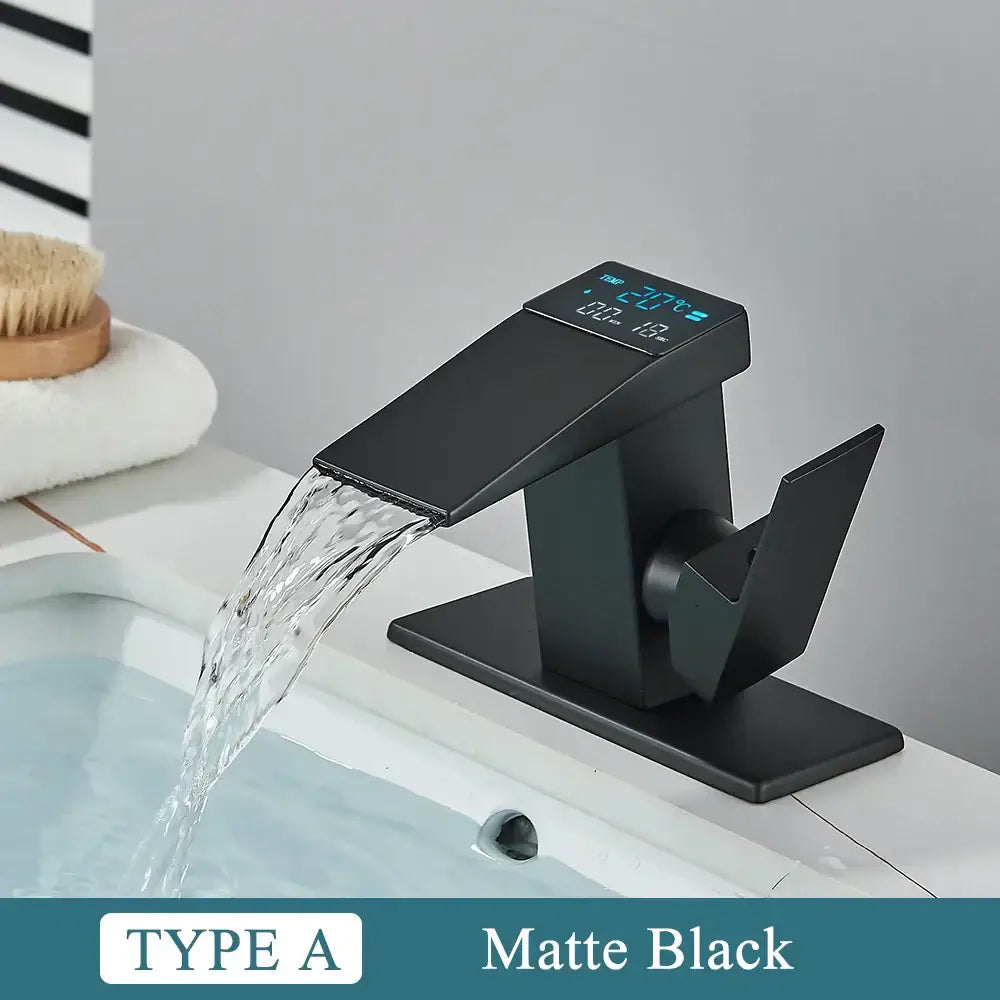 Modern matte black bathroom faucet with brass waterfall design and integrated temperature display by decorbites