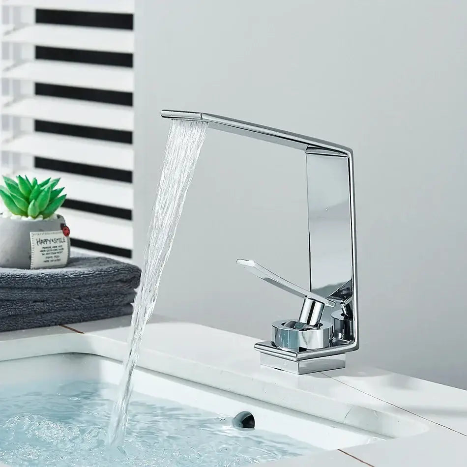 Modern matte black decorbites basin faucet with chrome waterfall spout and single lever handle for bathroom use