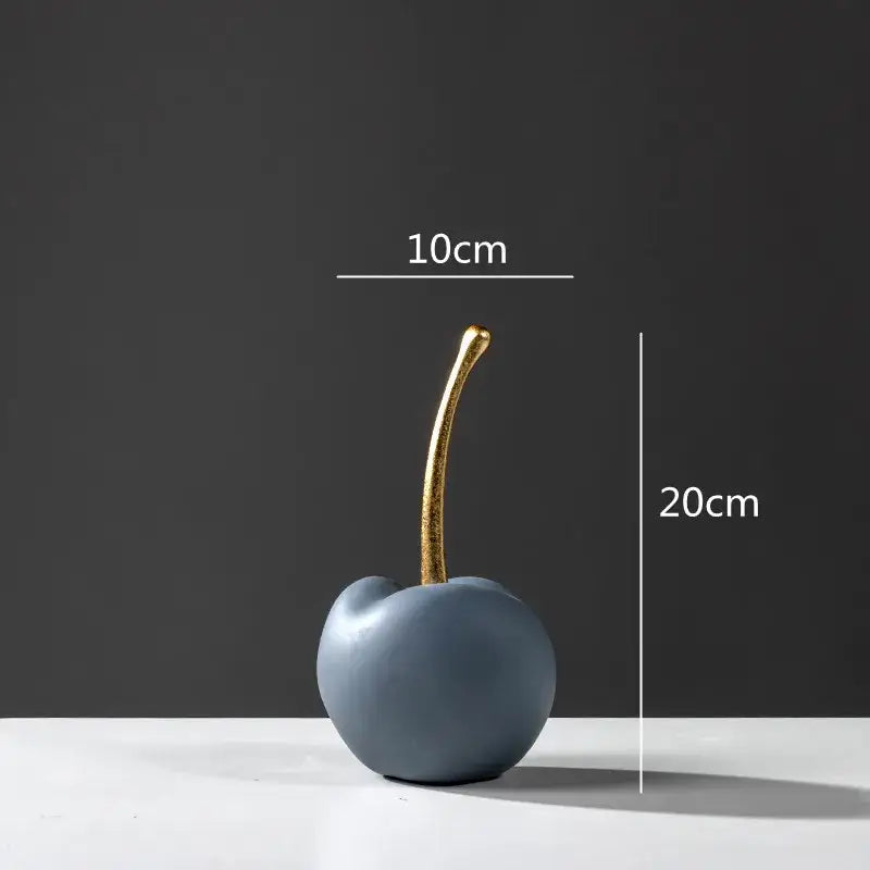 A sleek matte blue resin apple ornament with a polished gold stem for modern living room decor
