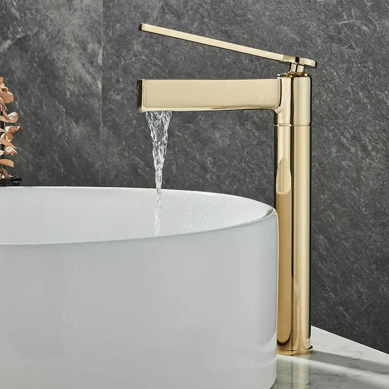 Modern matte chrome decorbites basin faucet with gold-toned minimalist design and tall cylindrical spout for bathroom use