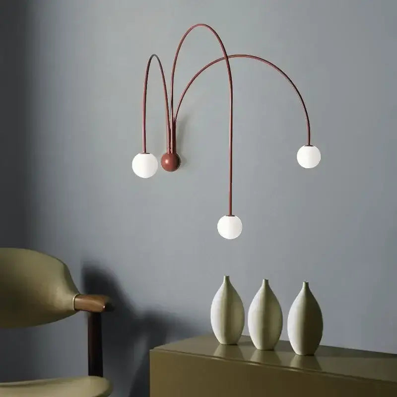 Modern wall lamp with three curved matte copper arms and opaque white glass ball bulbs for living room decorbites glass ball