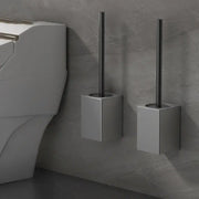 Modern matte gray and black metal toilet brush holder set with sleek cylindrical brush for bathroom use