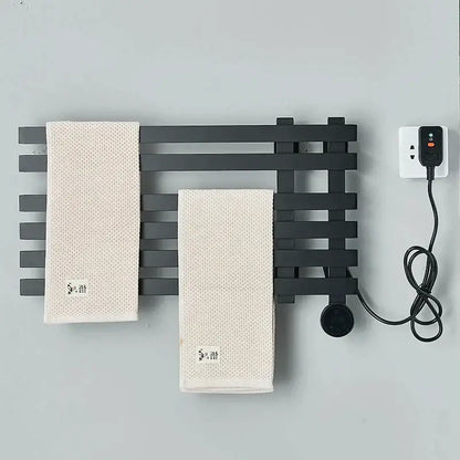 Modern matte gray black metal towel warmer with two off-white textured towels for digital touch bathroom decorbites use