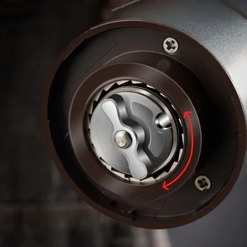 Modern matte gray electric bean grinder with black and silver manual adjustment knob for precise grind settings