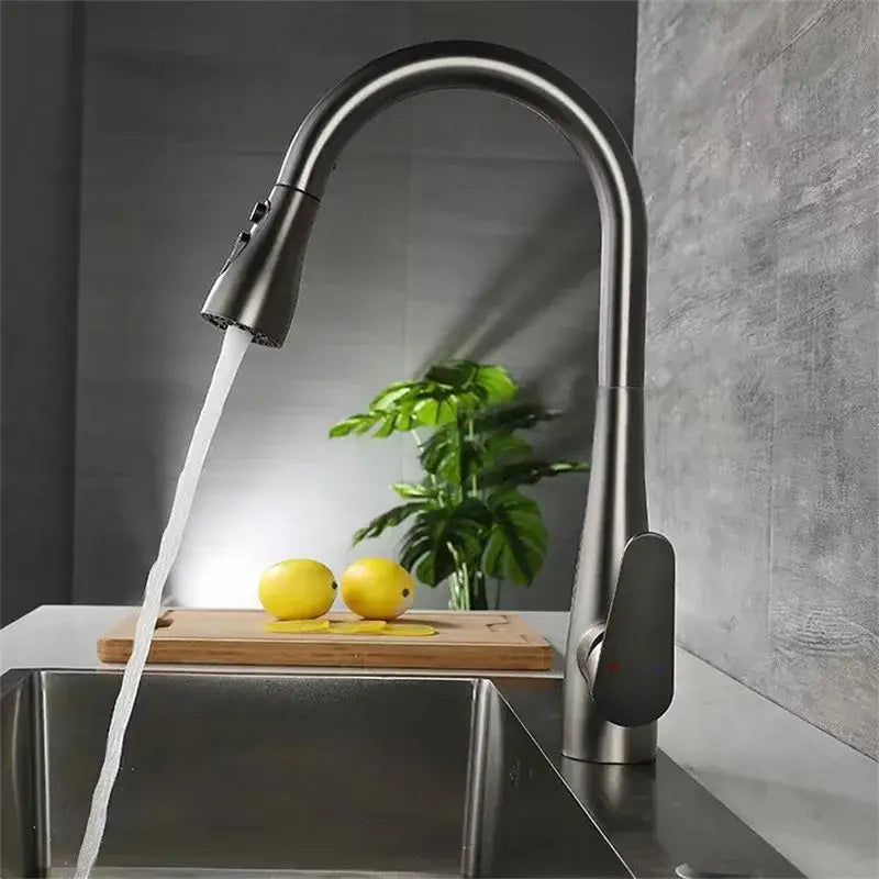 Modern matte gray kitchen faucet in brushed stainless steel with sleek curved spout and pull-down spray head