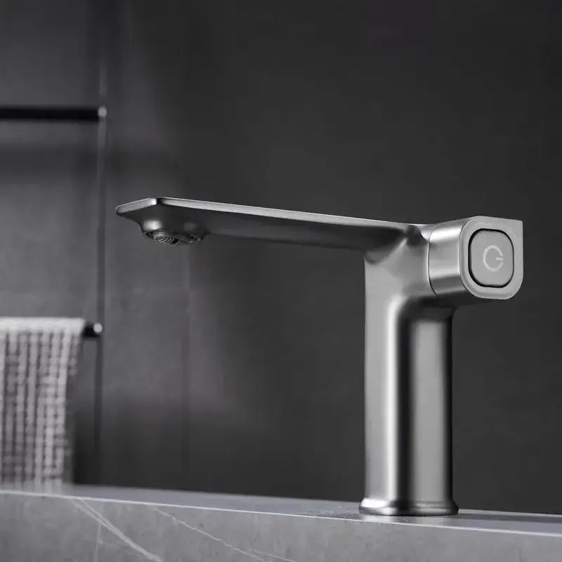 Modern matte gray sink mixer with sleek minimalist design and square control knob featuring illuminated icon
