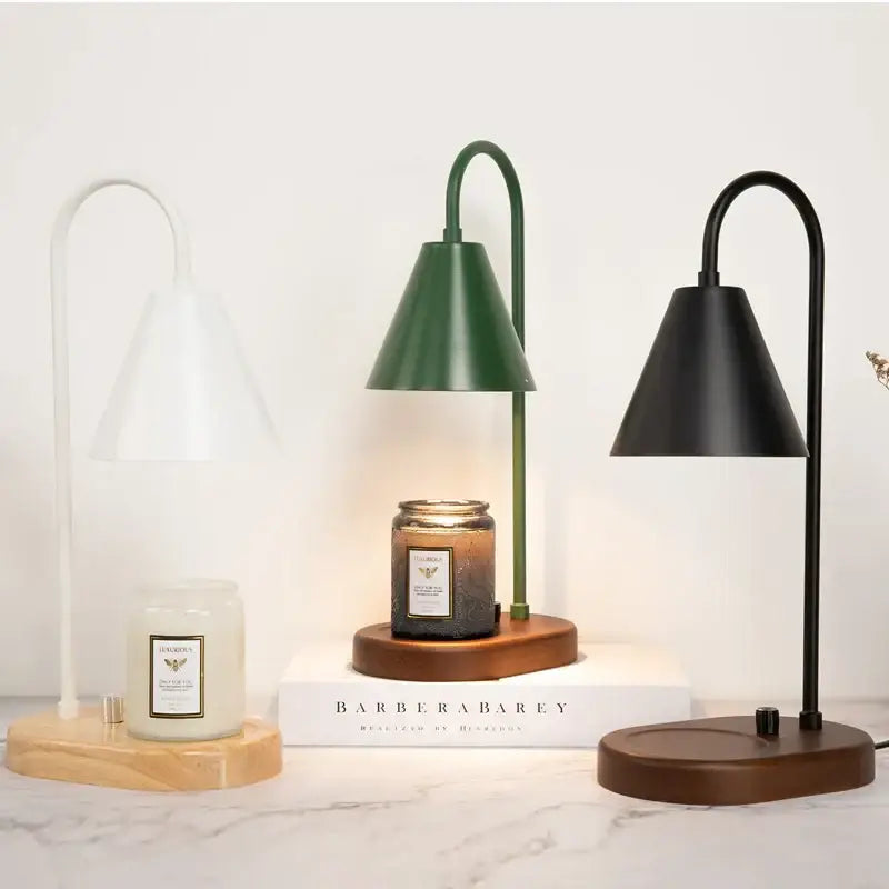 Modern matte green electric candle lamp warmer with wooden base and sleek curved metal arm for bedroom use