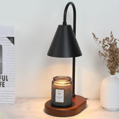 Black metal electric candle lamp warmer with sleek curved arm and conical shade on wooden base for bedroom use