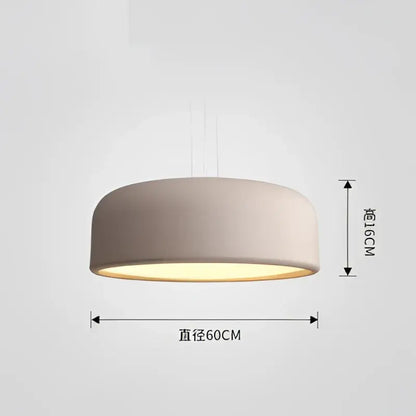 Modern matte green macaron ceiling chandelier with a beige cylindrical shade and warm yellow glow for living room decorbites colorful macaron