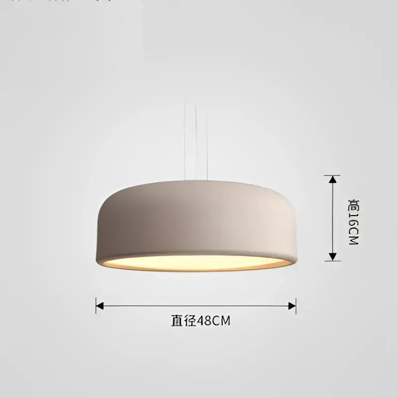 A modern matte beige cylindrical pendant light with warm glow ideal for decorbites colorful macaron ceiling chandelier