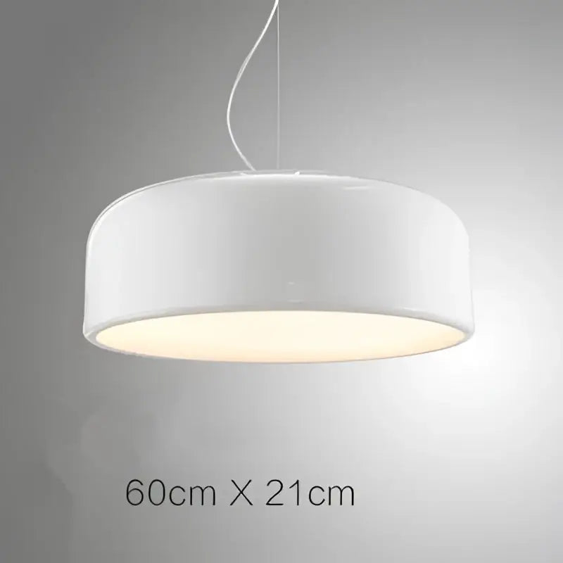 A sleek modern white pendant light with a warm glow in a decorbites colorful macaron ceiling chandelier design