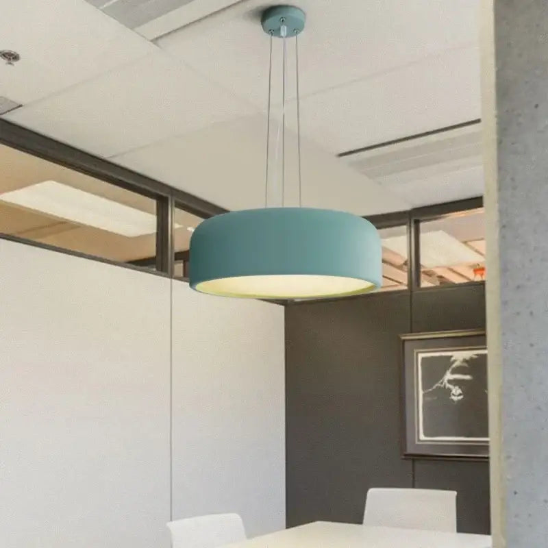 Modern matte green macaron ceiling chandelier with a teal cylindrical shade and warm glow for living room decorbites colorful macaron
