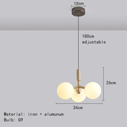 Modern matte red decorbites glass ball pendant lighting fixture with brass-finished iron frame and frosted glass globes for living room