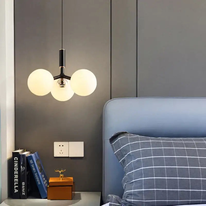 Modern black decorbites glass ball pendant lighting fixture with three frosted glass globe bulbs for living room use