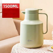 A matte sage green 1500ml thermal insulation vacuum coffee pot with a sleek design and sturdy handle for kitchen use