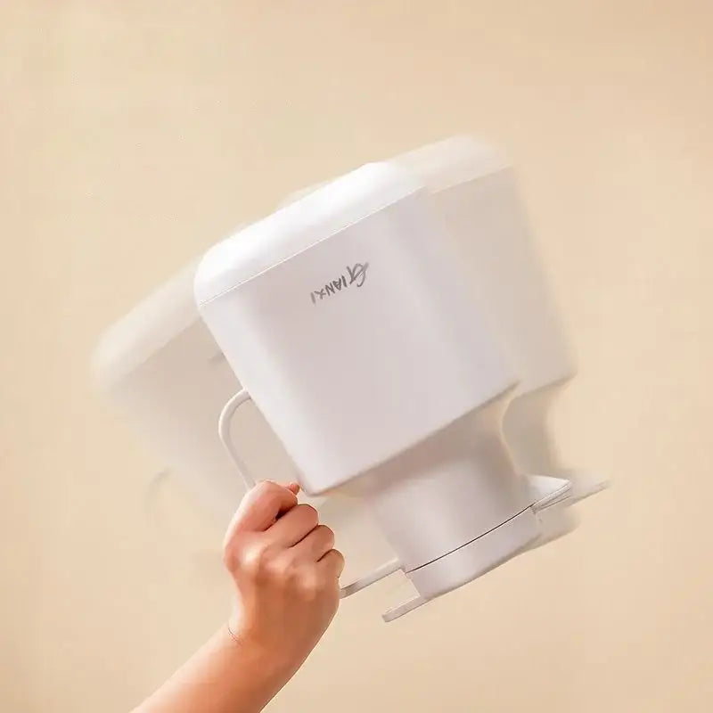 White plastic water filter pitcher with handle and logo beside a modern matte sage green thermal insulation vacuum coffee pot