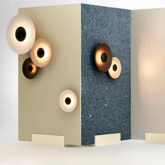 Modern matte white and brushed bronze ginger round wall lamp with minimalist glowing inner rings for bedroom decorbites ginger round wall
