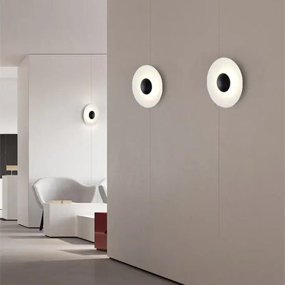 Modern matte white ginger round wall lamp with black center and brushed bronze accents for bedroom decorbites ginger round design