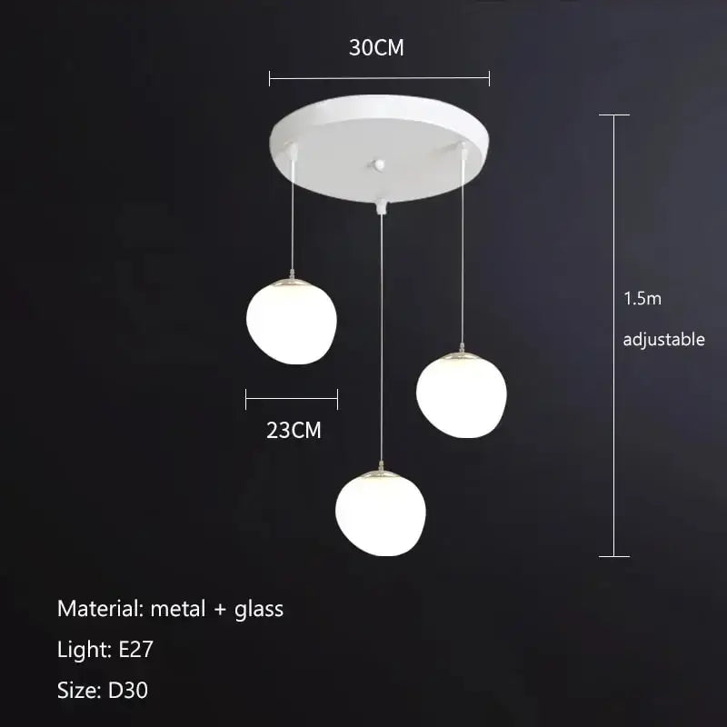 Modern matte white glass pendant light with three spherical globes and metal hardware for dining room decorbites gregg glass pendant