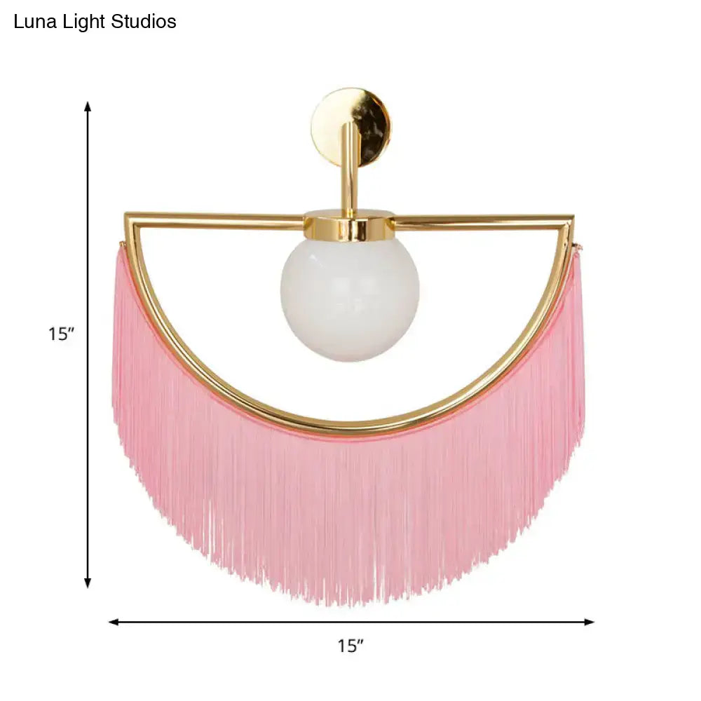 Modern matte white glass wall light with pink fringe tassel sconce and gold-toned metal frame wall light