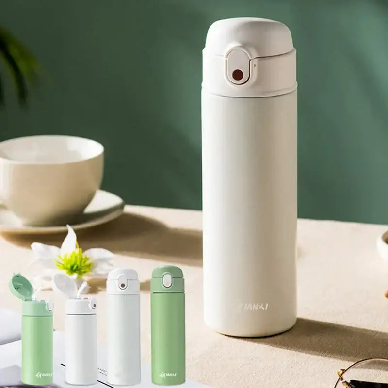 Cream-colored decorbites insulated stainless steel thermos bottle with a sleek minimalist design and flip-top lid
