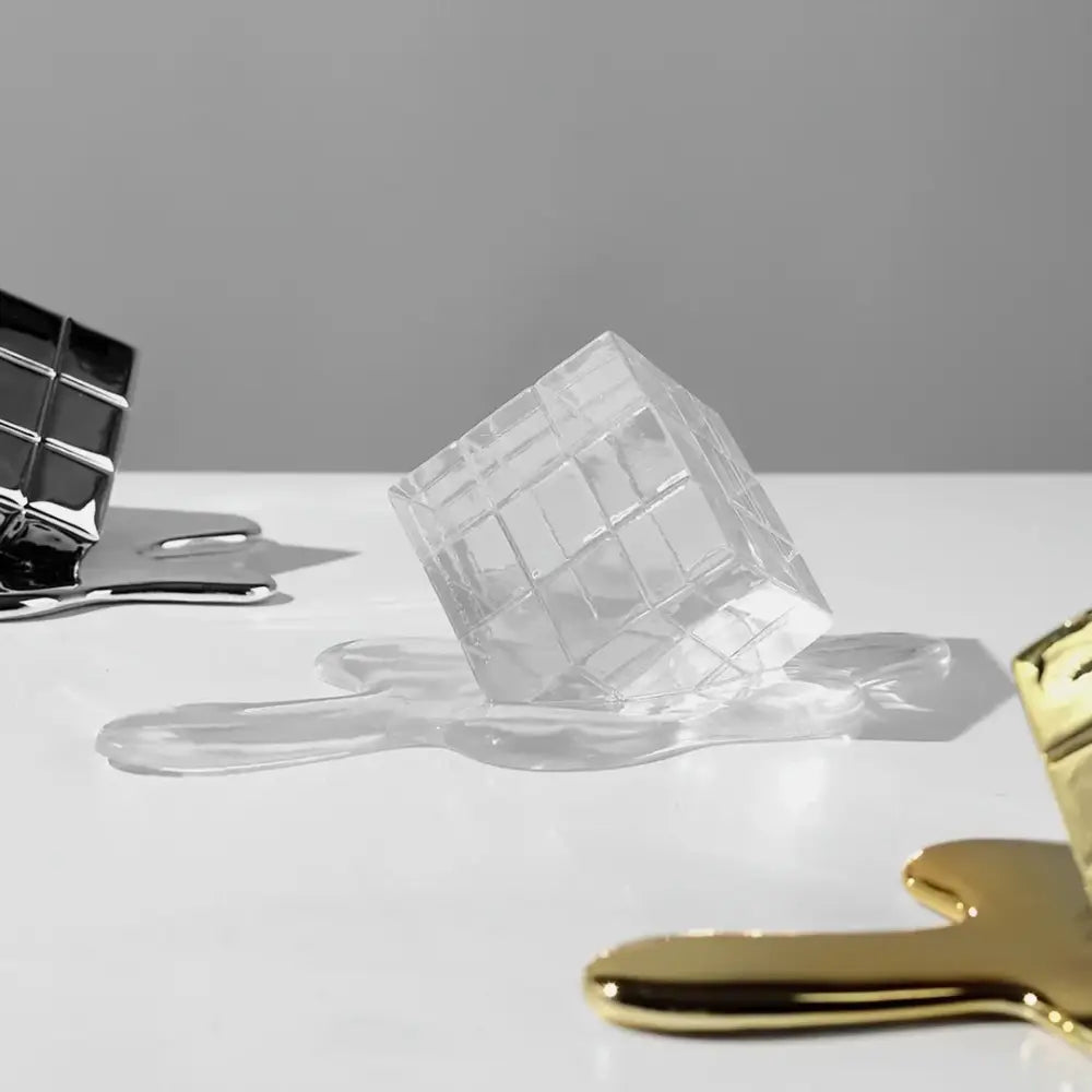 Modern melting geometric gold resin cube decorbites sculpture featuring a transparent acrylic grid resembling melting ice