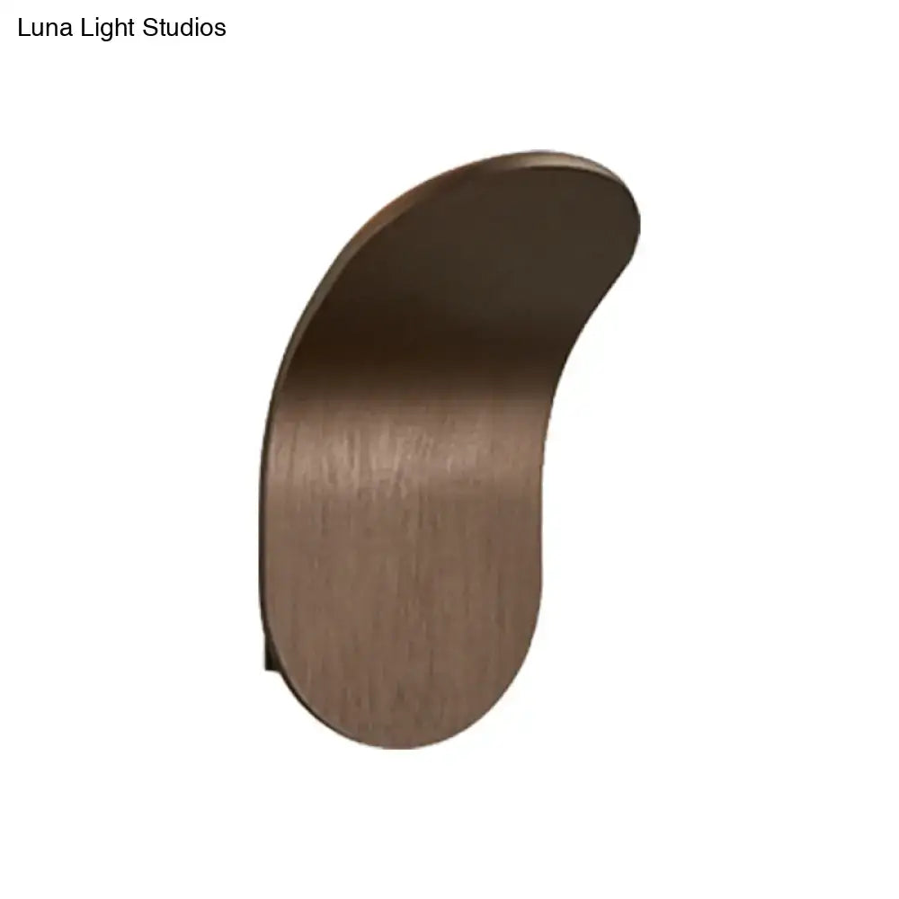 A sleek curved wall light with a brushed bronze metal bracket in black gold coffee finish for bedroom use