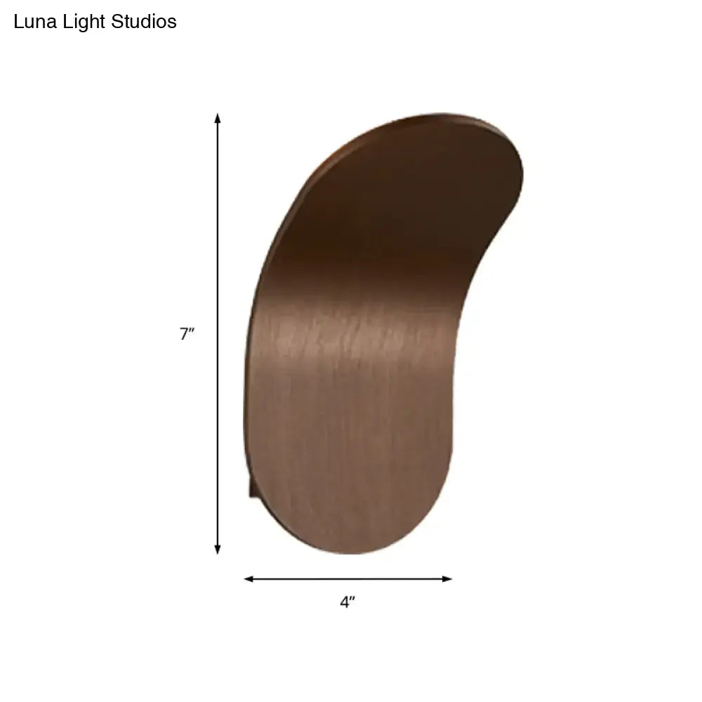 A sleek brushed bronze metal bracket wall light with a smooth curved design in black gold coffee finish for bedroom use