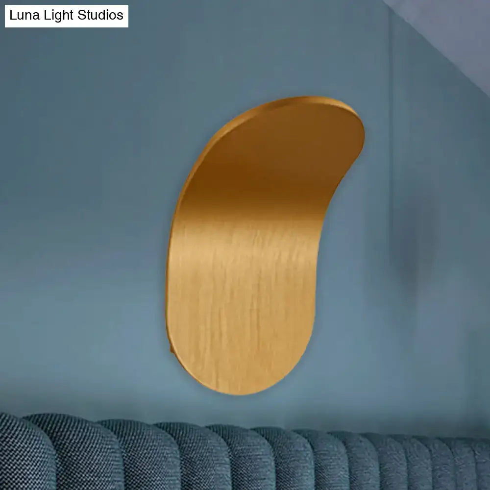 A sleek brushed gold metal bracket wall light with a curved crescent shape in black gold coffee finish for bedroom