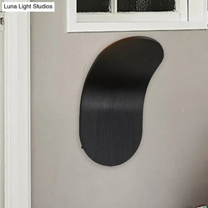 Black sleekly curved wall light with metal bracket in black gold coffee finish for modern bedroom decor