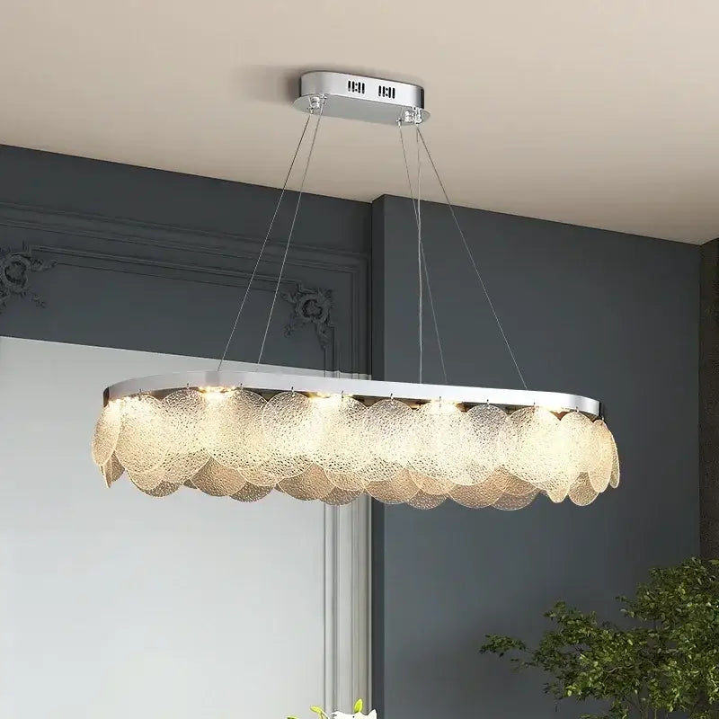Modern metal glass chandelier led ceiling lamp with sleek chrome frame and cascading translucent bubble shades emitting warm light