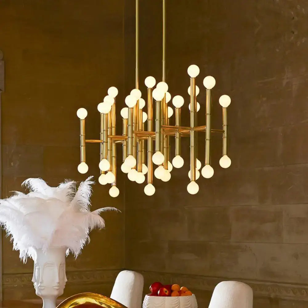 Gold-toned modern DecorBites™ island light with geometric bamboo-inspired structure and multiple e12 e14 spherical bulbs