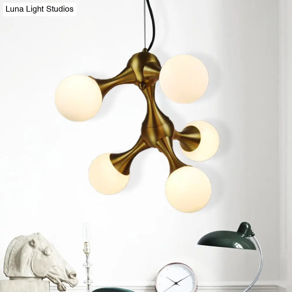 Lámpara de araña moderna de metal con forma de estrella y pantalla de cristal esférica - Disponible en 5/9/15 luces