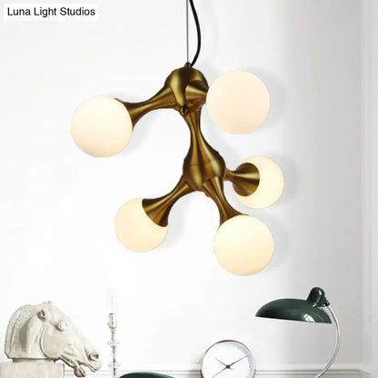 Lámpara de araña moderna de metal con forma de estrella y pantalla de cristal esférica - Disponible en 5/9/15 luces