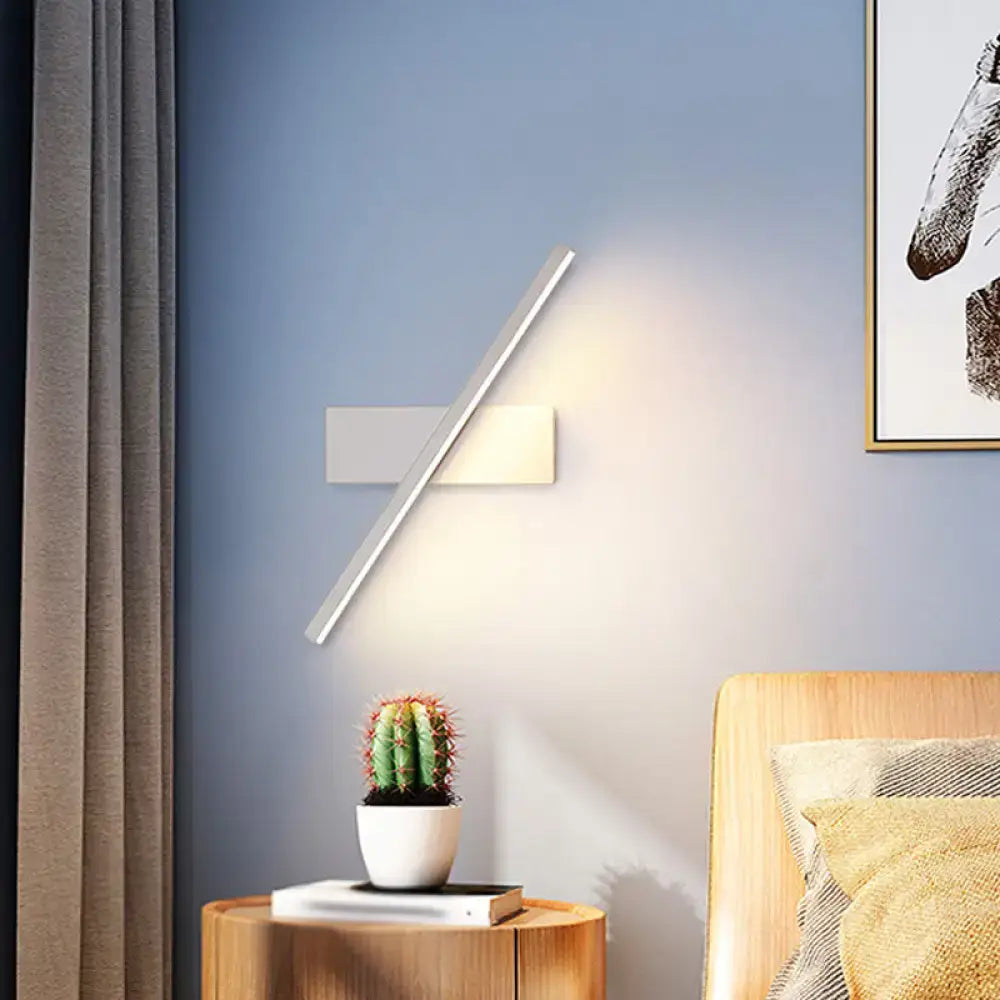 Modern metallic black and white linear vanity wall sconce with sleek matte white and brushed silver panels
