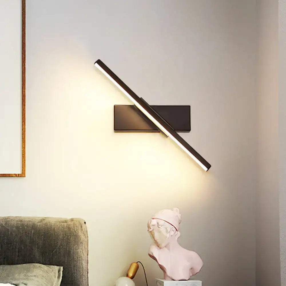 Modern metallic black and white linear vanity wall sconce with sleek angular design for bathroom lighting