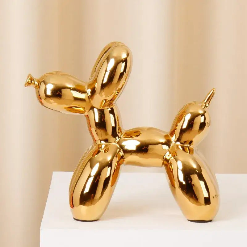 Golden glossy modern metallic ceramic balloon dog statue with sleek reflective surface for living room decorbites decor