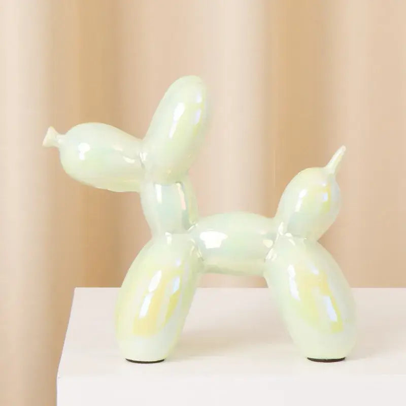 Glossy pale green ceramic balloon dog statue with smooth iridescent finish modern metallic decorbites ceramic balloon dog