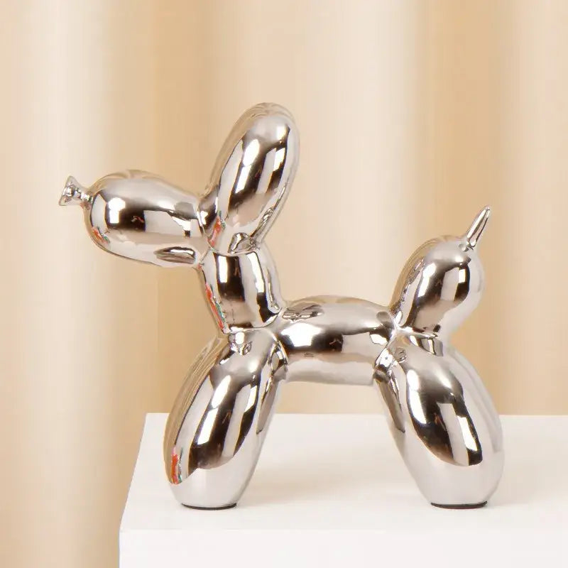 Shiny chrome decorbites ceramic balloon dog statue with smooth reflective surfaces for modern living room decor