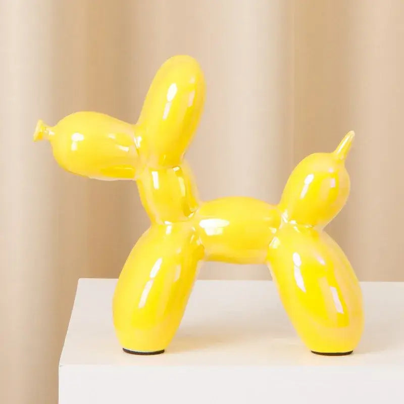 Vibrant yellow modern metallic ceramic balloon dog statue with glossy finish and black rubber feet for living room decorbites ceramic balloon dog decor
