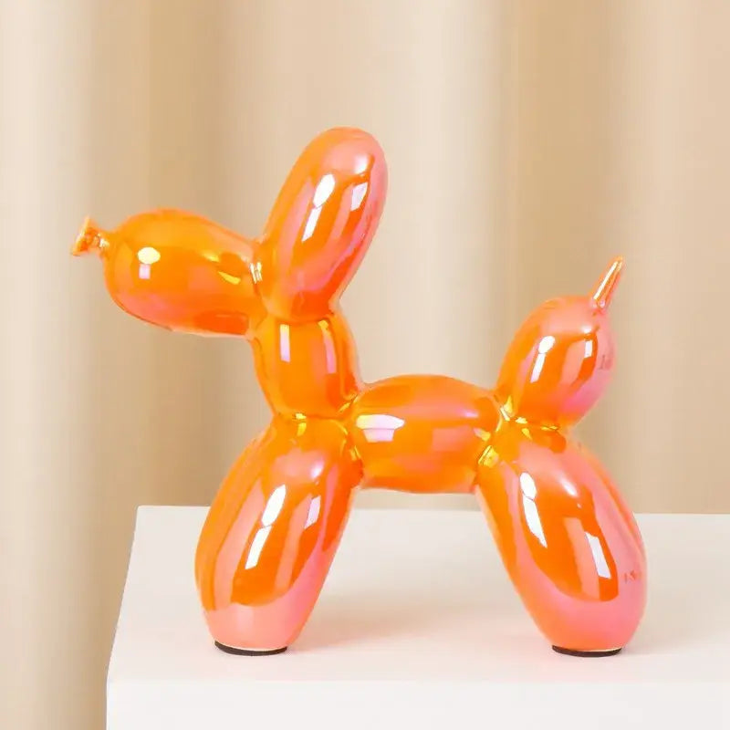 Vibrant orange and pink modern metallic ceramic balloon dog with iridescent finish for living room decorbites ceramic balloon dog